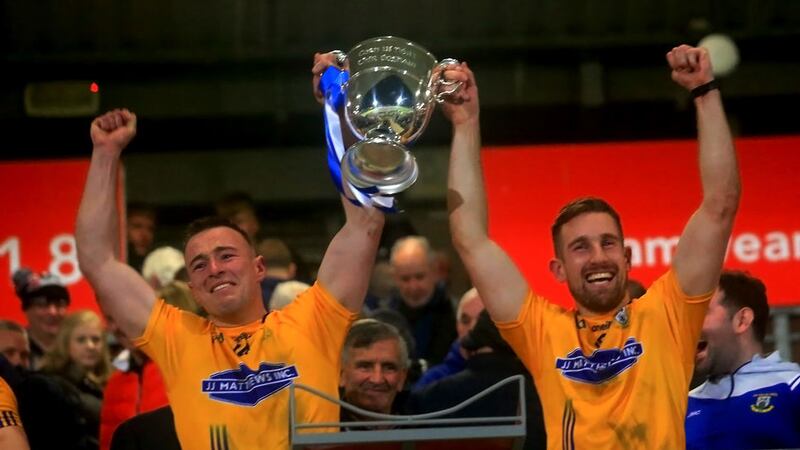Dromore's Tiarnan and Niall Sludden with the O'Neill Cup after winning the Tyrone SFC.<br />Picture Seamus Loughran&nbsp;