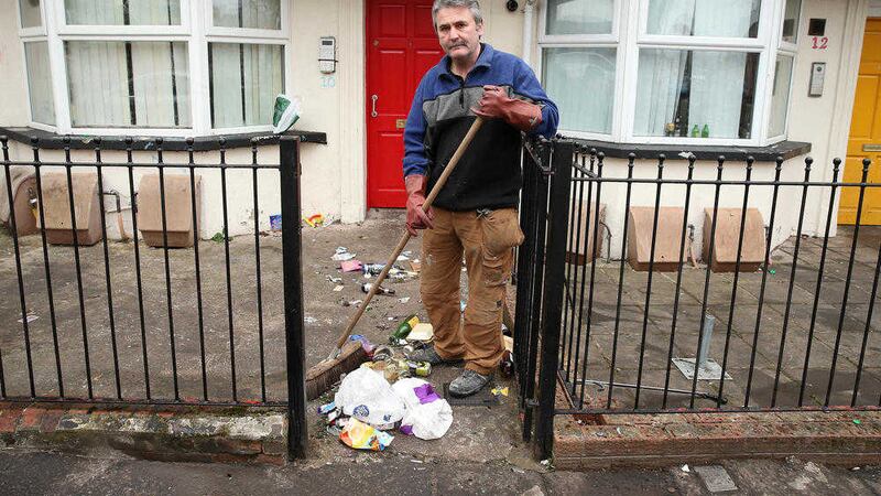 Councillor and landlord Declan Boyle clearing up in the Holylands after St Patricks Day. Picture by Mal McCann 