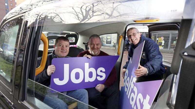 Cllr Ciaran Beattie, Belfast City Council, Stephen Savage, general manager, Belfast Taxis CIC and driver Sean McCarthy launch the new Belfast Taxi Bus Service Employment Academy, which will create up to 20 taxi bus driver jobs. 