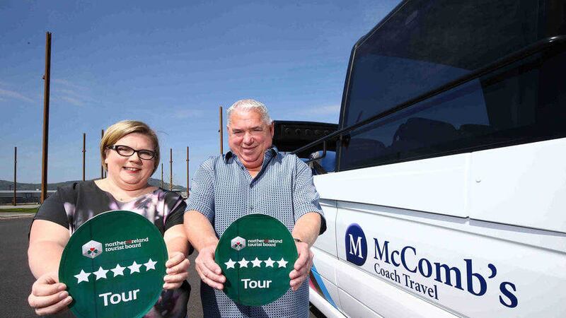Caroline and Rodney McComb show off their five-star rating after taking delivery of their new EVM cabriolet coach 