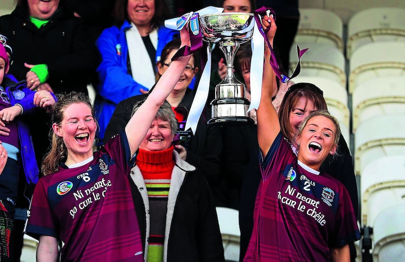 CHAMPIONS Clare McGrath (right) lifts&nbsp;the trophy with Aoife N&iacute; Chaiside after&nbsp;Slaughtneil&rsquo;s win over Sarsfields in the&nbsp;2018 All-Ireland Senior Club Camogie&nbsp;Championship final. Picture by Inpho&nbsp;