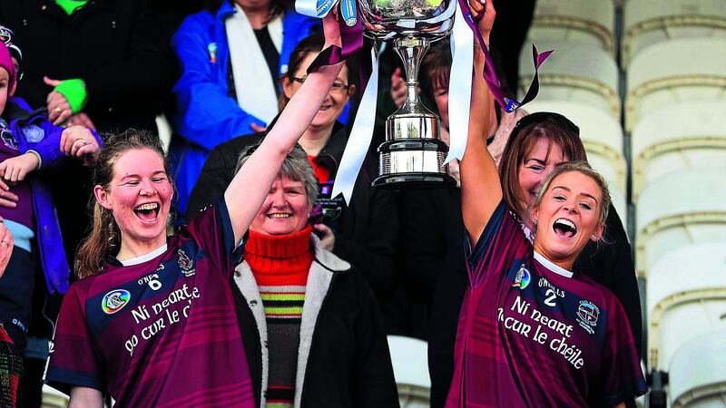 CHAMPIONS Clare McGrath (right) lifts&nbsp;the trophy with Aoife N&iacute; Chaiside after&nbsp;Slaughtneil&rsquo;s win over Sarsfields in the&nbsp;2018 All-Ireland Senior Club Camogie&nbsp;Championship final. Picture by Inpho&nbsp;