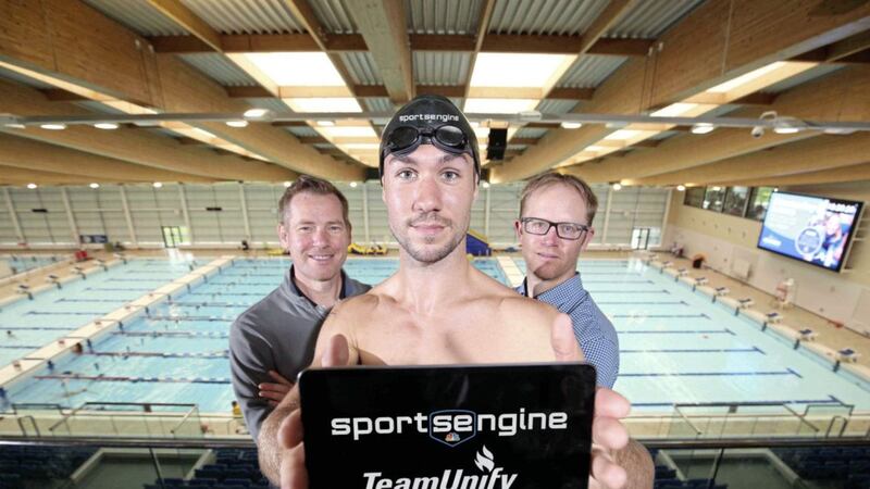 CREST OF A WAVE: Belfast-based NBC Sports executive Brian Smith (left), who will lead SportsEngine&rsquo;s growth plans, with Tim LaRoche (right) of TeamUnify and swimmer Ciaran Sloan at the Bangor Aurora Aquatic and Leisure Complex 