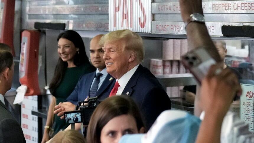 Former President Donald Trump stands with Walt Nauta as he visits Pat’s King of Steaks in Philadelphia (AP)