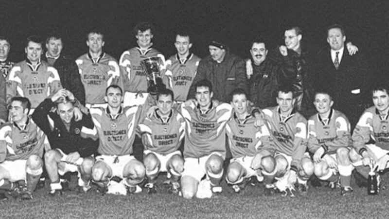 CHAMPIONS...The victorious Omagh Town team celebrate after clinching the Irish News Cup at the Ballymena Showgrounds