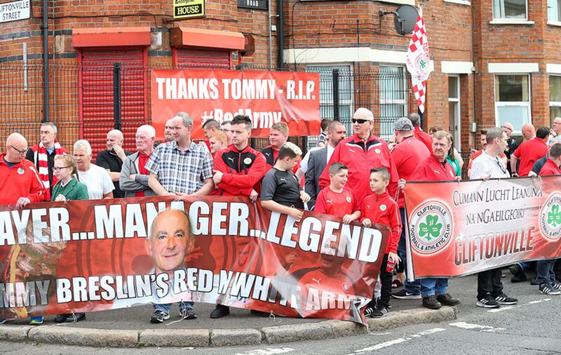 A large group of fans await the funeral cortege of Tommy Breslin as it passes the club's football ground in north Belfast. Picture by Mal McCann&nbsp;