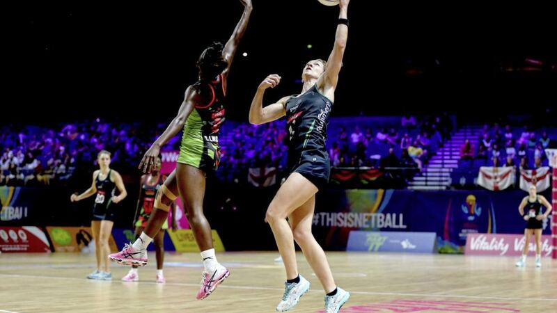 Caroline O&#39;Hanlon (right) and Malawi&#39;s Takondwa Lwazi during the Netball World Cup match at the M&amp;S Bank Arena, Liverpool. Picture by Nigel French, Press Association 