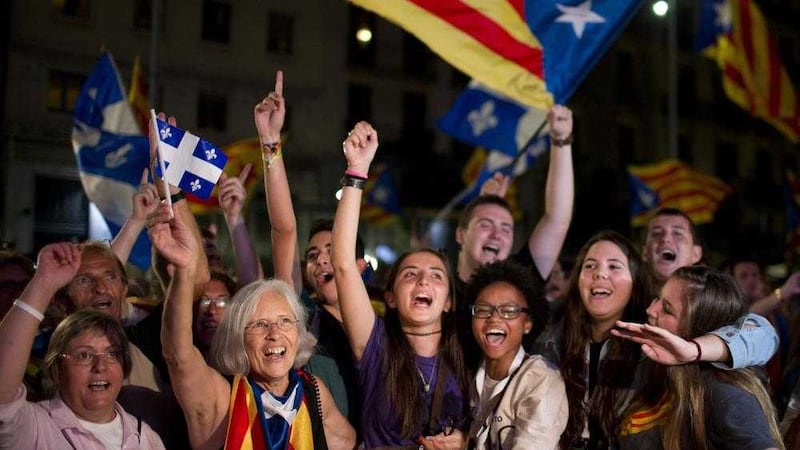 Catalonian pro-independence supporters celebrate in Barcelona 