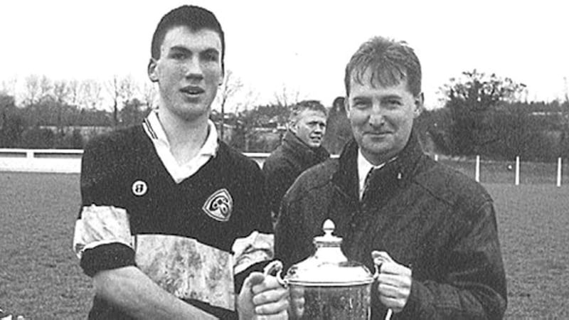 SAINTS TRIUMPH...St Mary&rsquo;s College Clady were celebrating recently after winning the county Derry U16 Vocational Schools final with a slender 1-8 to 1-7 victory over a tough St Patrick&rsquo;s Dungiven side. Eamon McSorley, Ulster Bank Maghera, presents the cup to a delighted St Mary&rsquo;s captain, Kevin McCann 