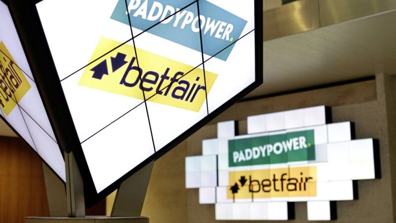 Paddy Power Betfair revealed the costs of last year&#39;s merger left it nursing annual losses of &pound;5.7 million, but it saw revenues jump 18 per cent higher after a &quot;transformational&quot; year 
