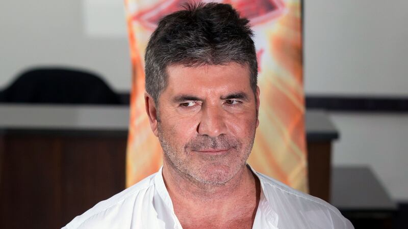 The X Factor boss was reportedly seen being transported from his house on a stretcher early this morning.