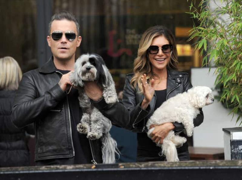 Robbie Williams and his wife Ayda Field (PA)