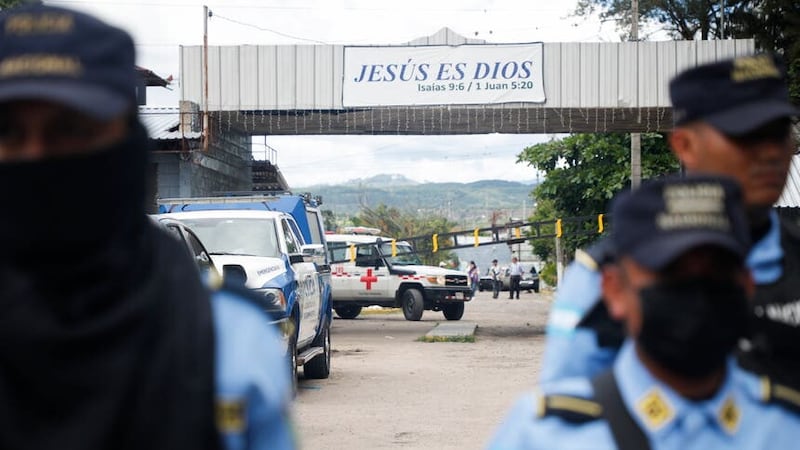 An ambulance is seen at the entrance of the women’s prison in Honduras (Elmer Martinez/AP)