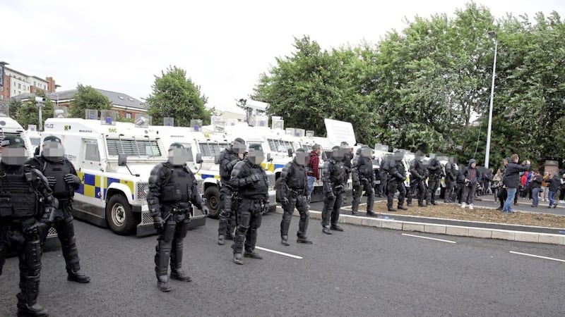 Police block the route of an Anti-Internment League parade in west Belfast last year  