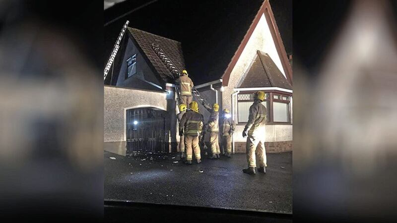 Fire fighters at a house in Co Down after it was damaged by a lightning strike on Monday 