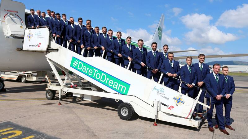 The Northern Ireland squad pose for a photo before jetting off to their training camp from George Best Belfast City Airport on Monday<br />Picture by PA