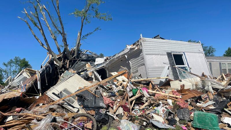 A storm-damaged mobile home is surrounded by debris at Pavilion Estates mobile home park just east of Kalamazoo, Michigan (Joey Cappelletti/AP)