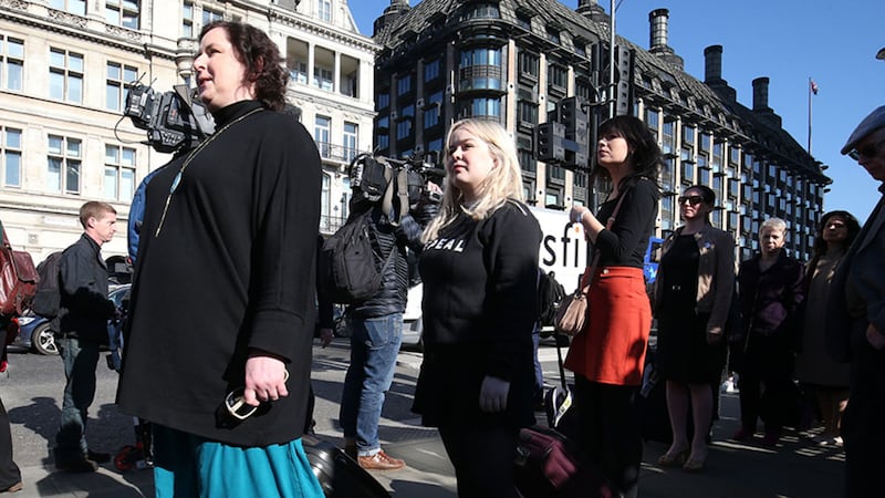 Derry Girls cast members Siobhan McSweeney (left) and Nicola Coughlan join women impacted by Northern Ireland's strict abortion laws who are carrying suitcases, symbolising the women who travel from Northern Ireland to Great Britain for terminations, across Westminster Bridge demanding legislative change&nbsp;