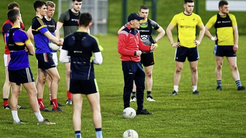 Mickey Harte speaks to the Louth players at training on Monday night 