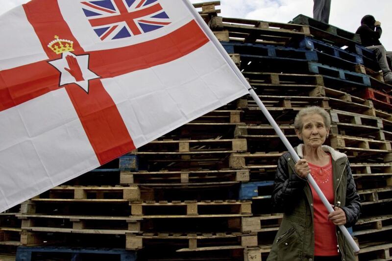 Flying the flag for the older generation while a bonfire builder takes a rest some way off the ground 