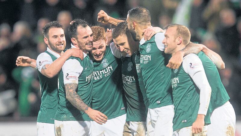 Hibernian players celebrate after securing their place in the Scottish League Cup final on Saturday