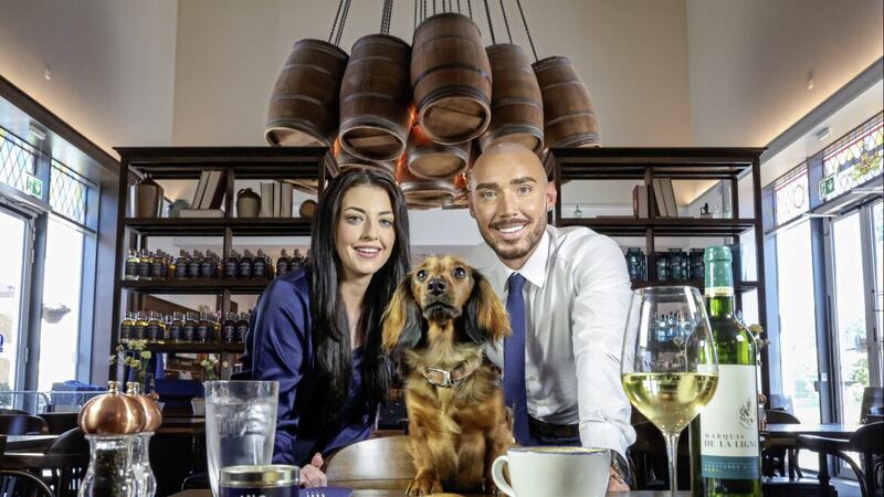 Managers of the new Hinch caf&eacute;, Harriet Finnigan and Darren Cosgrove, with Lola the puppy. 