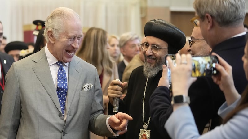 The King was given a handwritten Christmas letter by a young girl during a visit to the Coptic Orthodox Church Centre UK in Hertfordshire (Kin Cheung/PA)