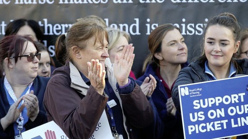 Nurses from the Royal College of Nursing gathered at the gates of the Royal Victoria Hospital staging industrial action in protest at pay and unsafe staffing levels.  Picture Mal McCann. 