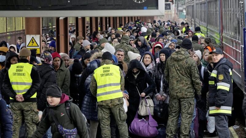 Refugees from Ukraine arrive at a railway station in Poland on Sunday. Picture: AP Photo/Czarek Sokolowski 