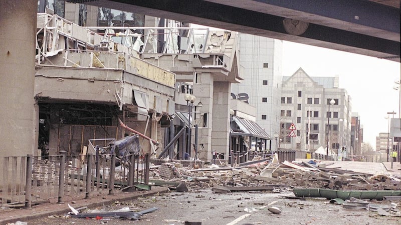 Bomb debris lays across the streets of London&#39;s Docklands following the IRA bomb blast 