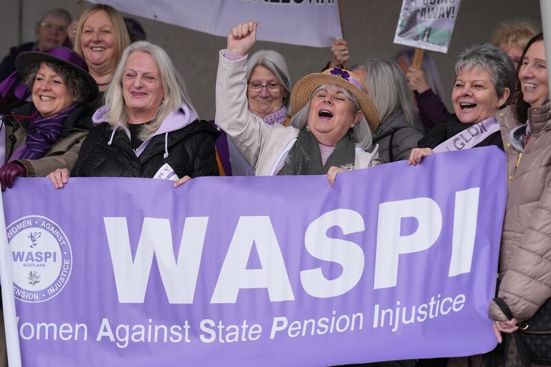 People at a Women Against State Pension Inequality (Waspi) protest outside the Scottish Parliament in Edinburgh, campaigning for justice and full compensation
