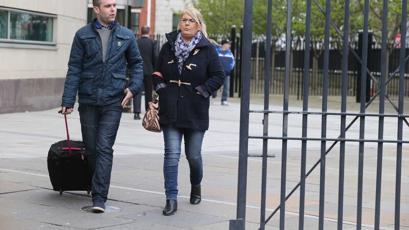 Kathleen Arkinson, Arlene's sister, leaves the inquest with her son today (Hugh Russell)