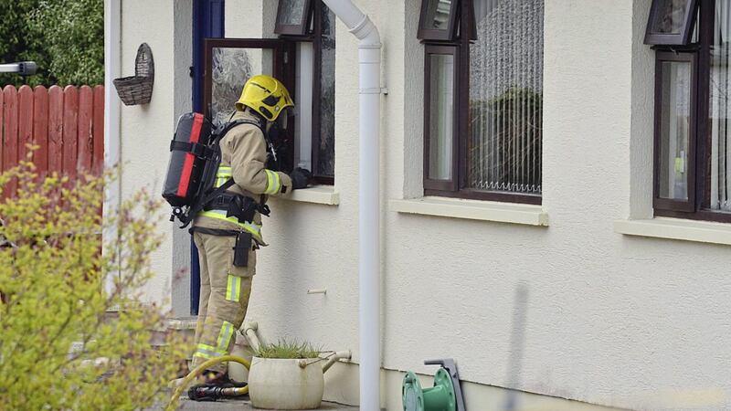 Emergency services at a house in Newcastle, Co Down, in April where five people, including two paramedics were taken to hospital after suffering from the effects of carbon monoxide poisoning
