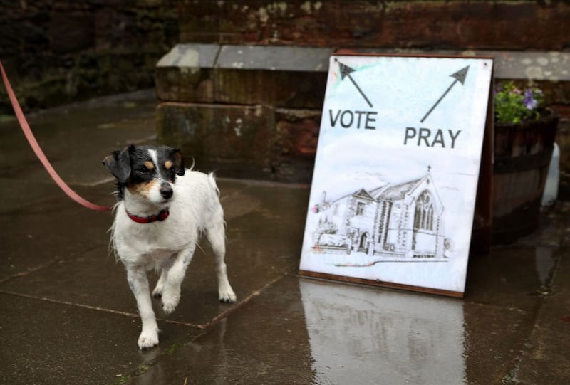 &nbsp;Skye the dog waits outside a polling station in St James' Church, Edinburgh. Jane Barlow/PA Wire