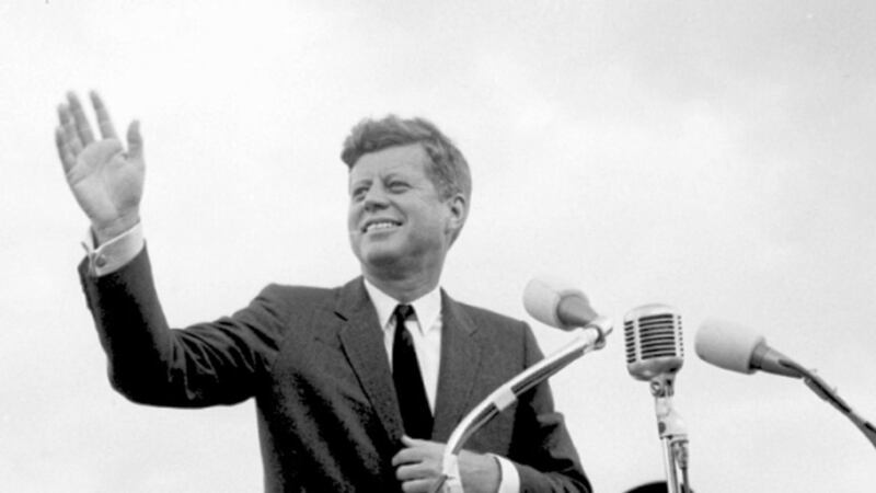 File photo dated 27/06/1963 of US President John F. Kennedy acknowledging the cheers of the crowd when he visits New Ross Co. Wexford. Photo: PA Wire