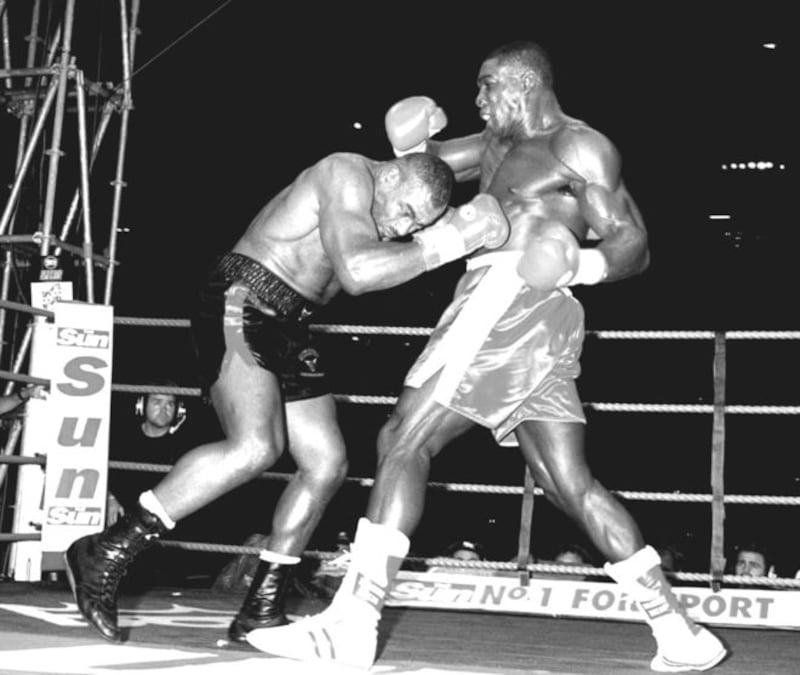 Challenger Frank Bruno puts WBC heavyweight champion Oliver McCall under pressure during their clash at Wembley Stadium in London on Saturday September 2 1995. Bruno won the title on points. Next up for the jovial big Londoner? Mike Tyson!