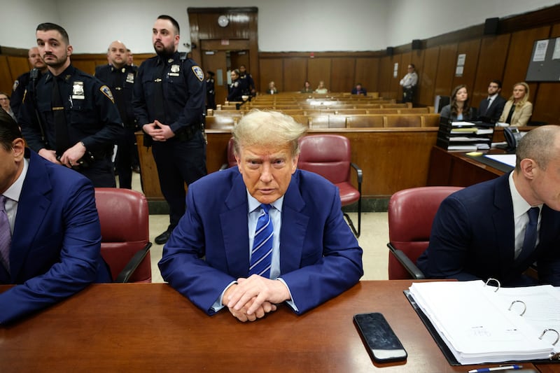 Former US president Donald Trump awaits the start of proceedings on the second day of jury selection at Manhattan Criminal Court in New York (Curtis Means/DailyMail.com via AP, Pool)