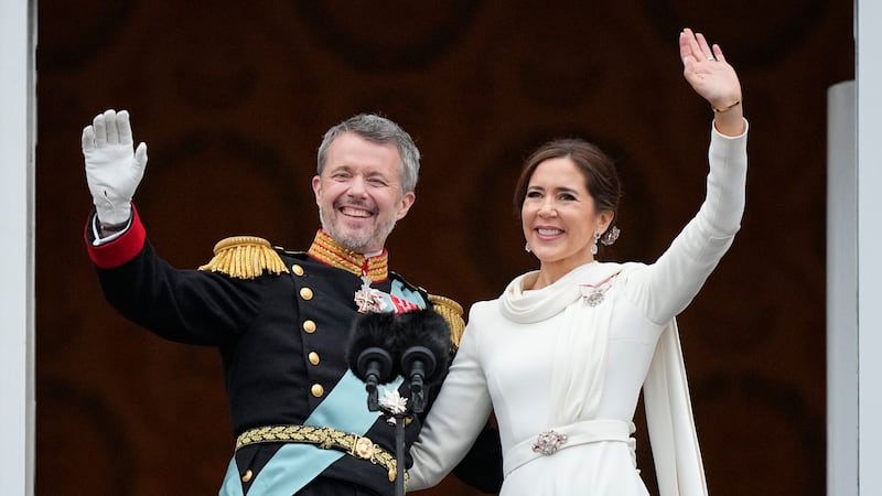 Denmark’s King Frederik X and Queen Mary wave from the balcony of Christiansborg Palace (Martin Meissner/AP)