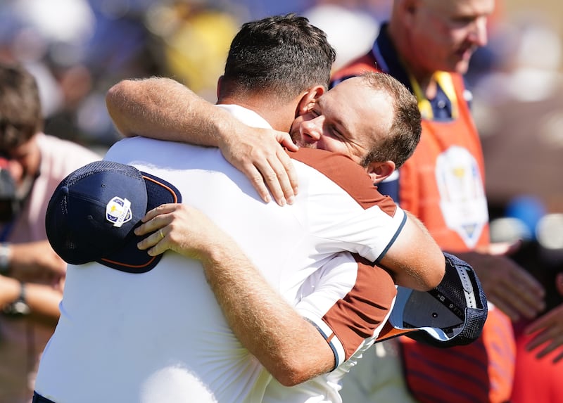 Jon Rahm and Tyrrell Hatton following their foursomes victory on day two of the 44th Ryder Cup in Rome
