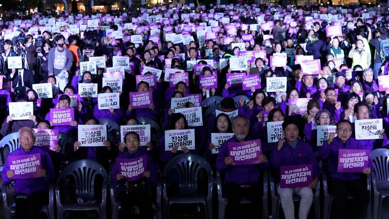 A massive rally was held on the first anniversary of the crowd surge that killed about 160 people in a Seoul alleyway (Ahn Young-joon/AP)