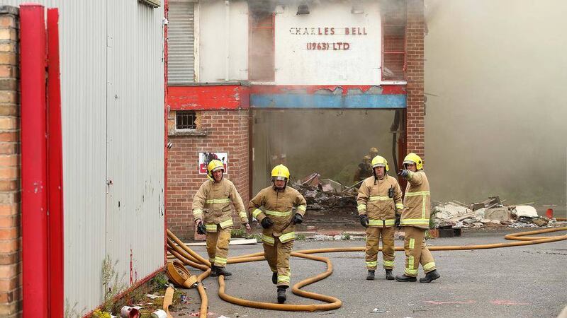 Firefighters at the scene of a blaze at a derelict factory off the Oldpark Road in north Belfast. Picture by Mal McCann 