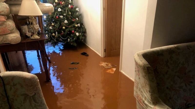 Heddwyn James’s Christmas presents were submerged when her house was flooded, but neighbours stepped in to help.