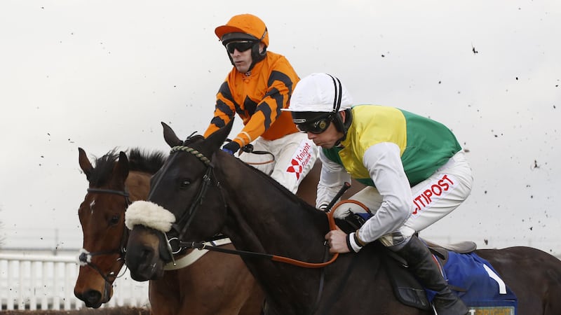 Many Clouds and Leighton Aspell (right) jump an early fence in company with Thistlecrack ridden by Tom Scudamore before going on to win The Betbright Trial Cotswold Chase Race&nbsp;