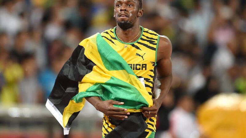 Jamaica's Usain Bolt celebrates winning the gold medal in the Men's 100 metres final at the IAAF World Championships at the Beijing National Stadium, China