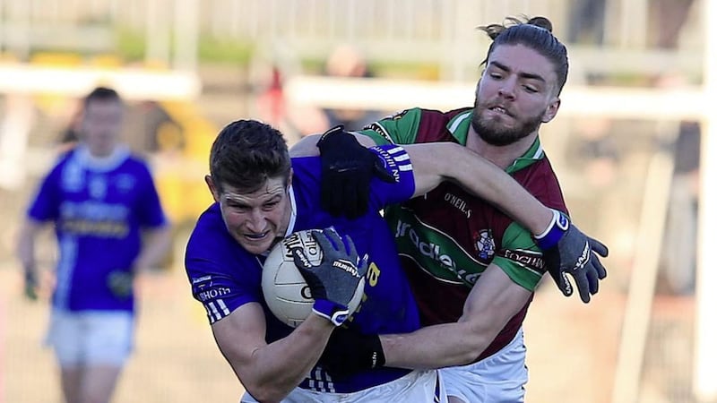 Eoghan Rua Ruairi Mullan puts Scotstown&#39;s Darren Hughes under pressure in the 2018 Ulster GAA Football Senior Club Championship clash at Healy Park in Omagh on November 18 2018. Picture by Philip Walsh. 