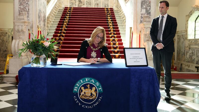 Councillor Tina Black, opening a book of condolence at City Hall for the victims of the explosion at Applegreen service station in the village of Creeslough in Co Donegal, where ten people have been confirmed dead. Picture by Belfast City Council/PA Wire