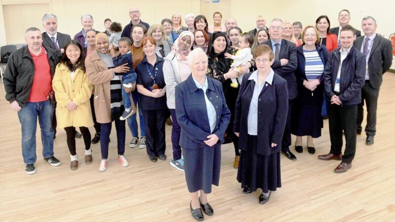 Sister of Charity: Members of the community in north Belfast turned out to recognise the contribution of Sister Bernadine, pictured centre front, from the Order of the Daughters of Charity, who retired last Friday after 17 years of work with homeless families from her base at Grainne House in north Belfast. Picture by Mark Marlow, Pacemaker Press. 