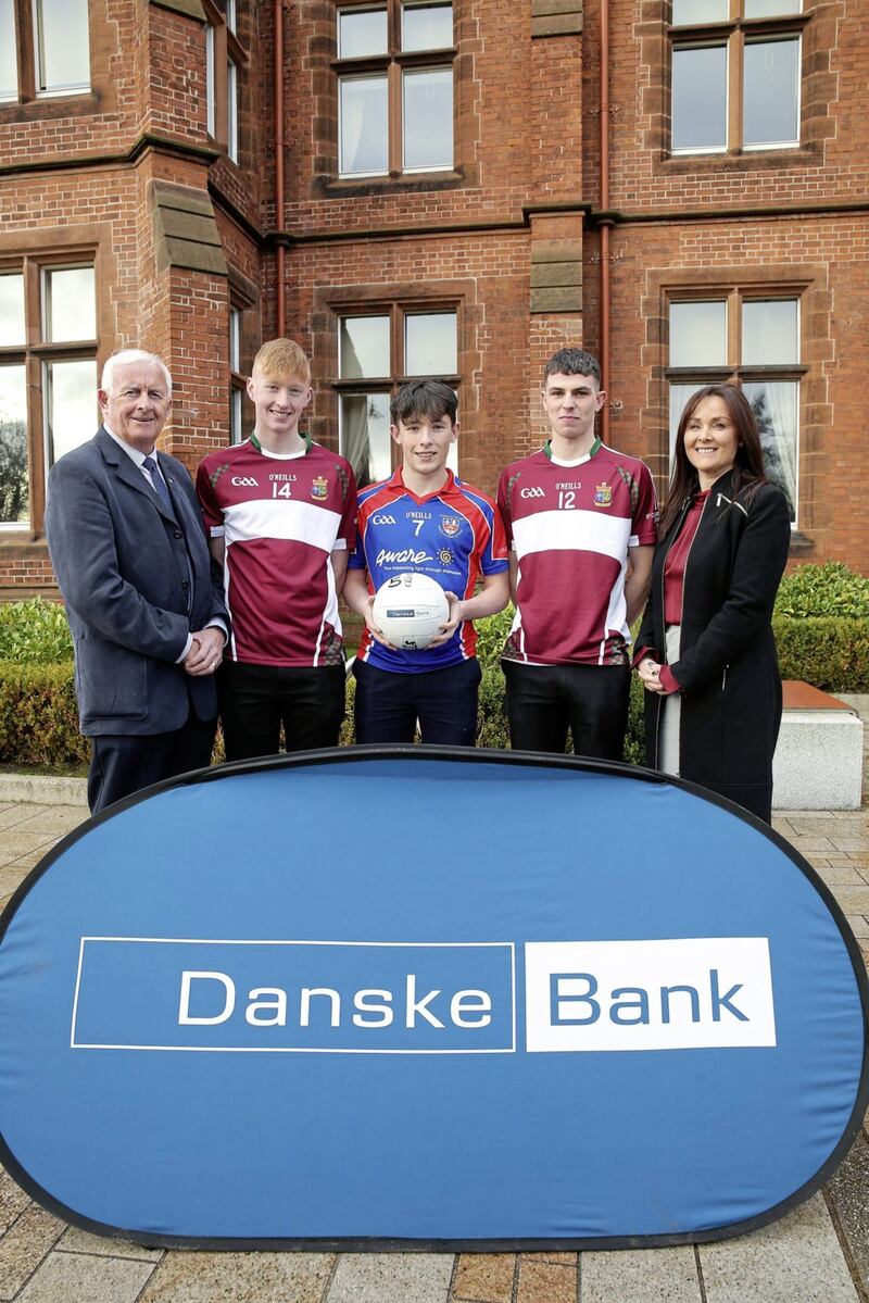Aisling Press, Head of Branch Banking at Danske Bank and Jimmy Smith, Chairman of the Ulster Schools GAA pictured with Patrick Dolan (St Columba&rsquo;s, Stranorlar), Aaron Doherty (Col&aacute;iste na Carraige, Carrick) and Oisin Gallen (St Columba&rsquo;s, Stranorlar). Both St Columba&rsquo;s and Colaiste na Carraige are included for the first time in an All-star team &ndash; all three lads play in the Markey Cup Photo by  Kelvin Boyes / Press Eye  