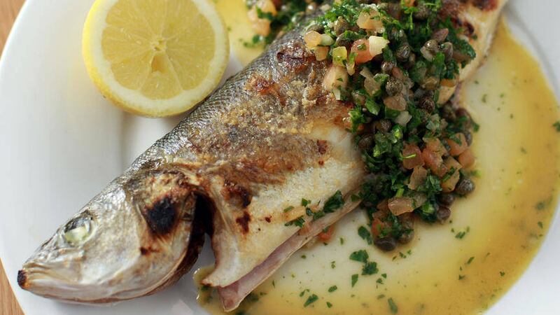 Grilled sea bass with tomato, capers and herbs