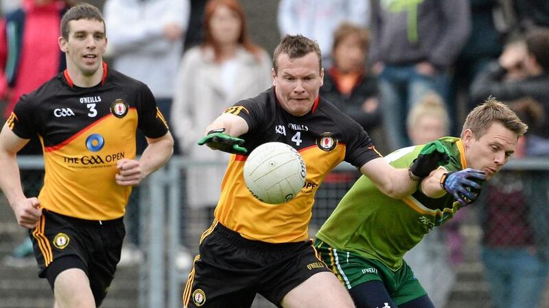 Tom&aacute;s &#39;Mossy&#39; Quinn challenges Ulster&#39;s Dan McCartan during Monday night&#39;s GAA Open charity game in Newcastle 